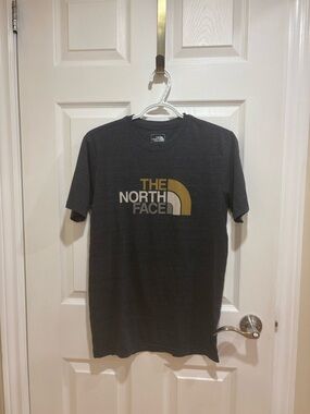 The North Face Men's Short Sleeve Tee in Charcoal with Gold Logo
